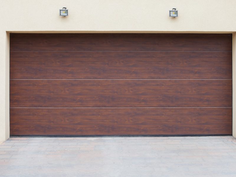 A closeup shot of brown sectional garage doors